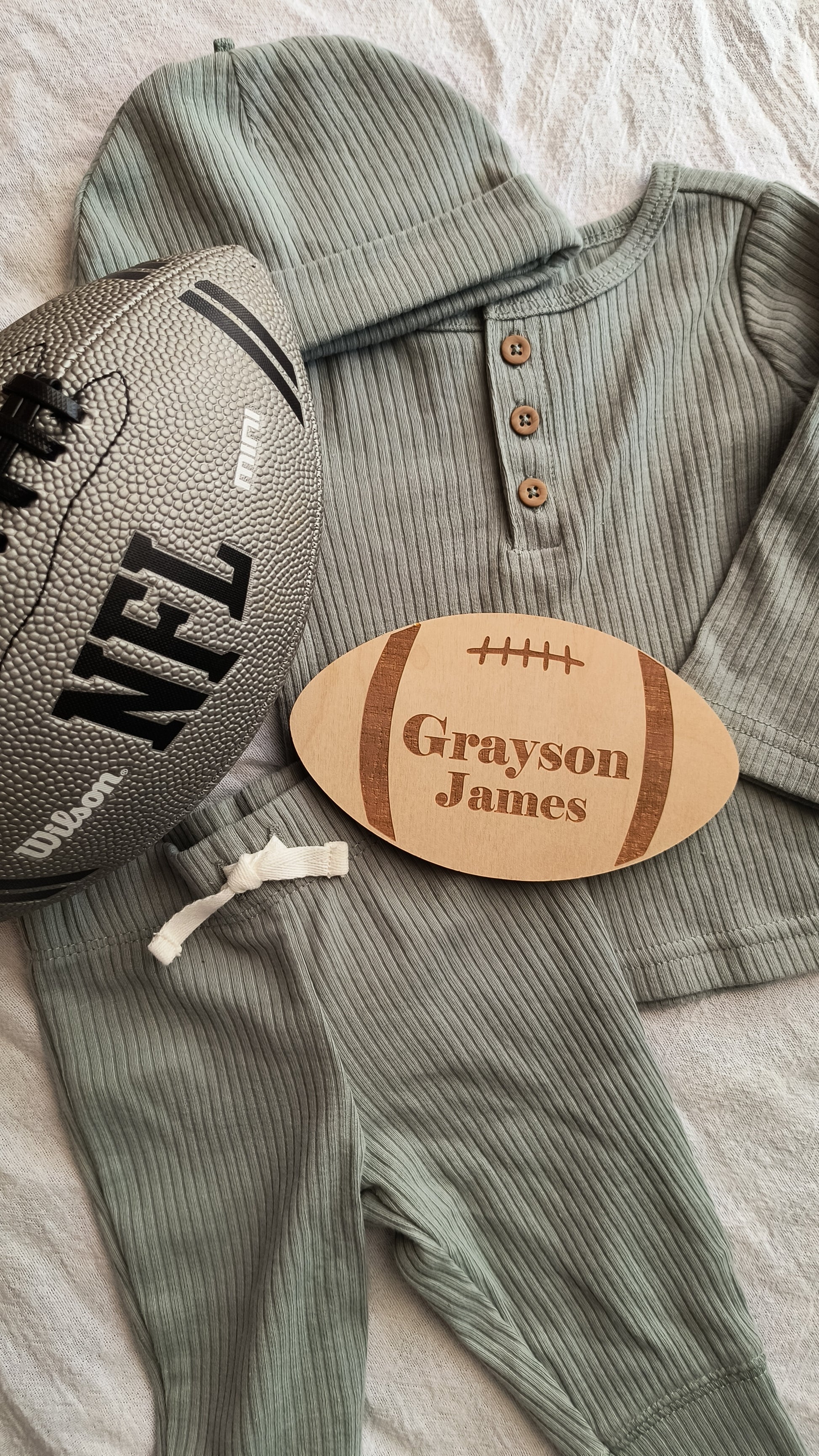 Personalized engraved football sign with baby's name. Perfect for announcing baby's name.